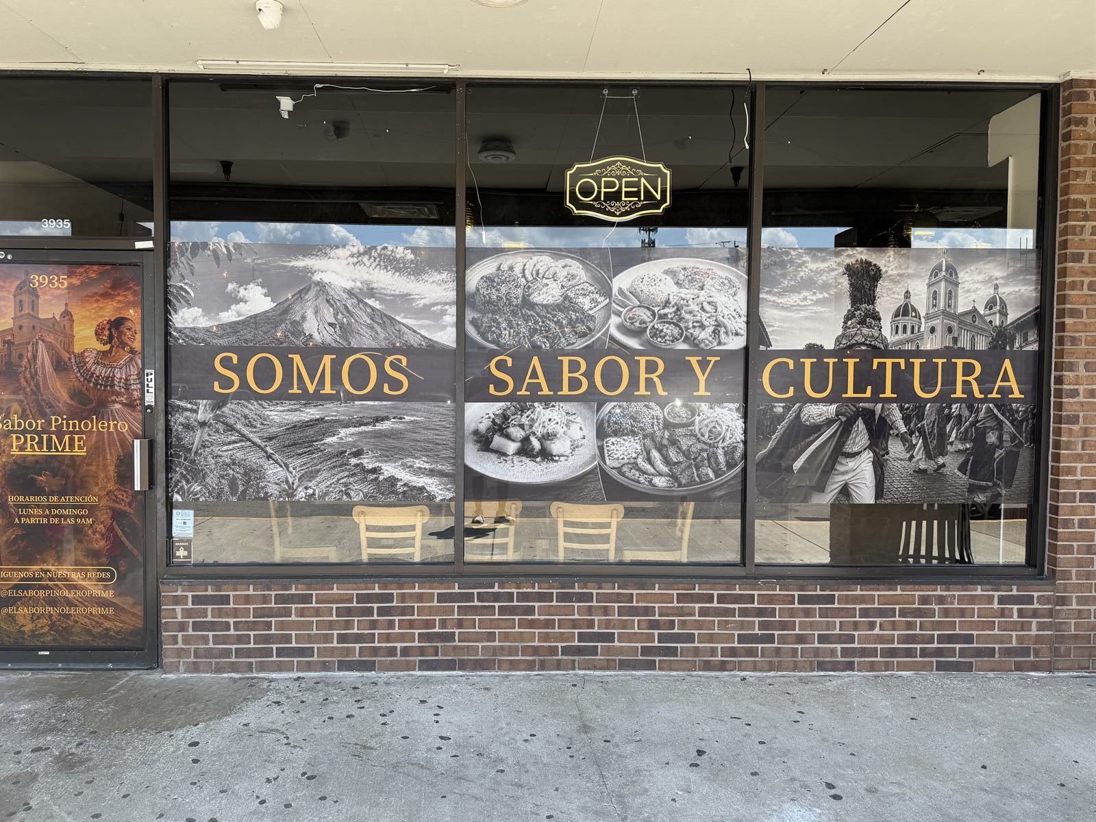 Full-glass window graphics on the storefront of El Sabor Pinolero restaurant